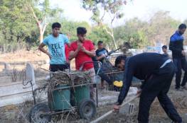 اللجنة الشعبية للاجئين بالبريج تنظم يوم تطوعي لتنظيف شوارع ومقبرة 